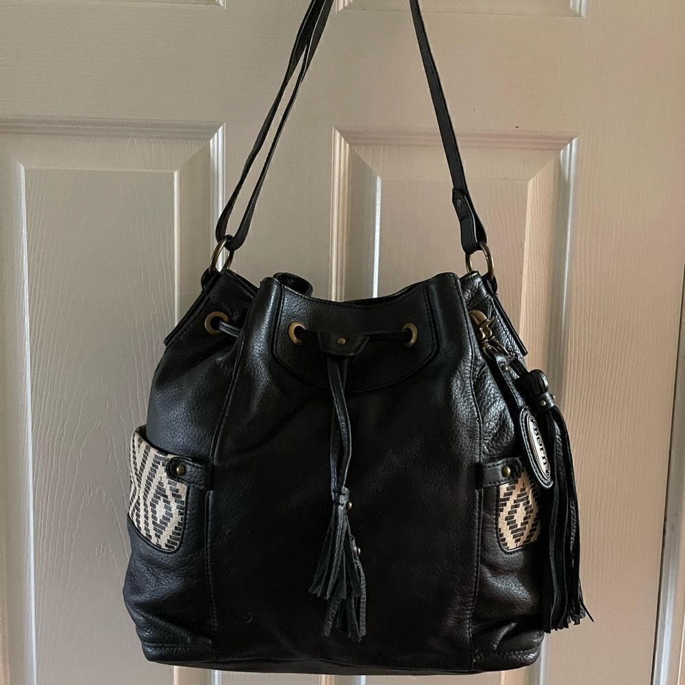 Born leather black shoulder bag drawstringโtasselsโaccentโsideโpockets